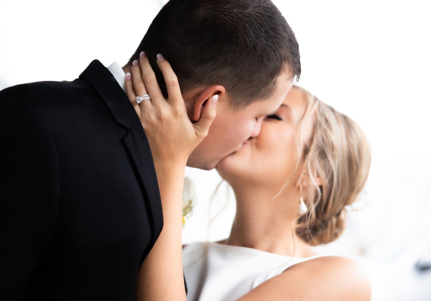 Intimate black and white portrait of a couple sharing a tender moment.
