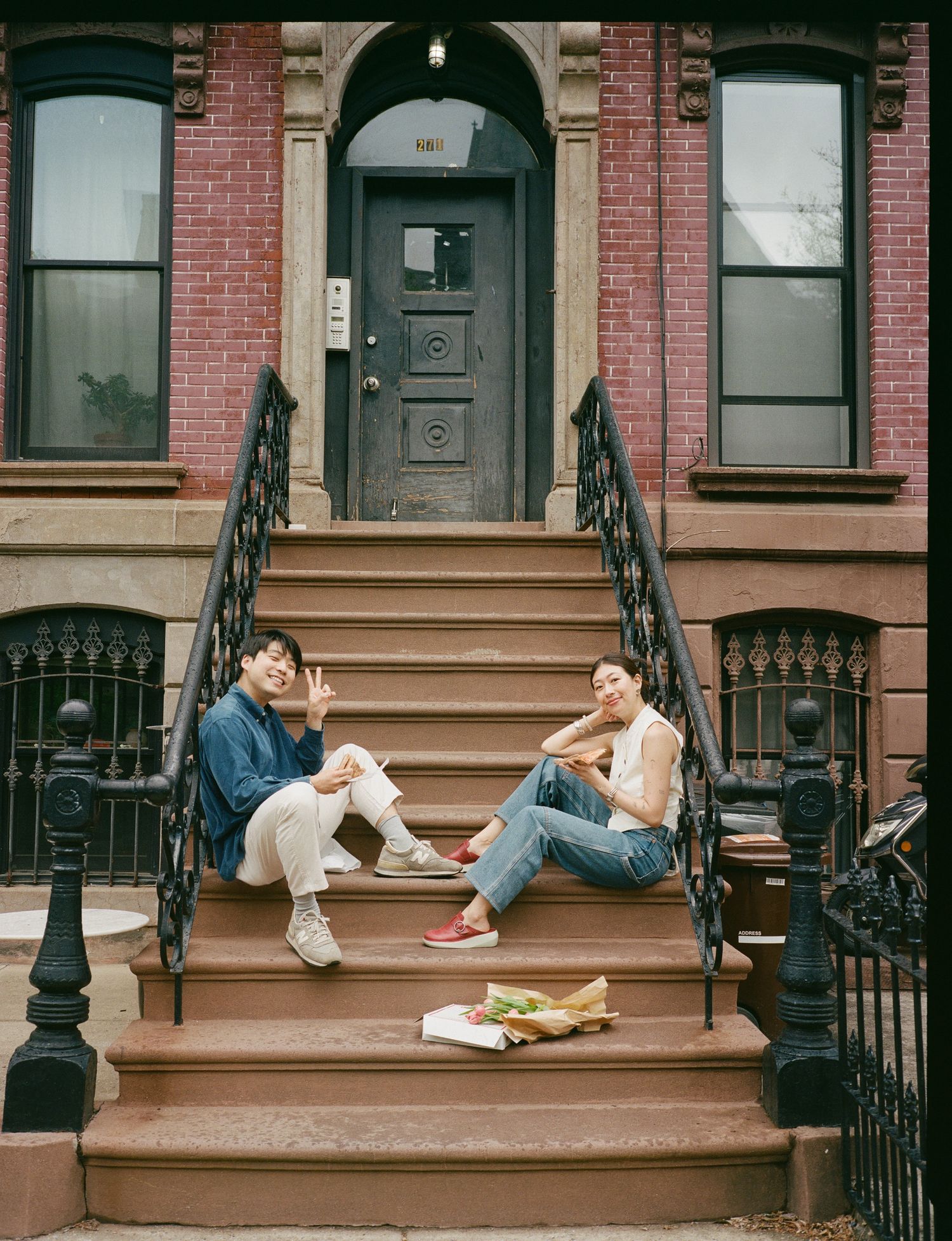 Three connected images show someone lounging on brownstone steps in New York City at different angles.
