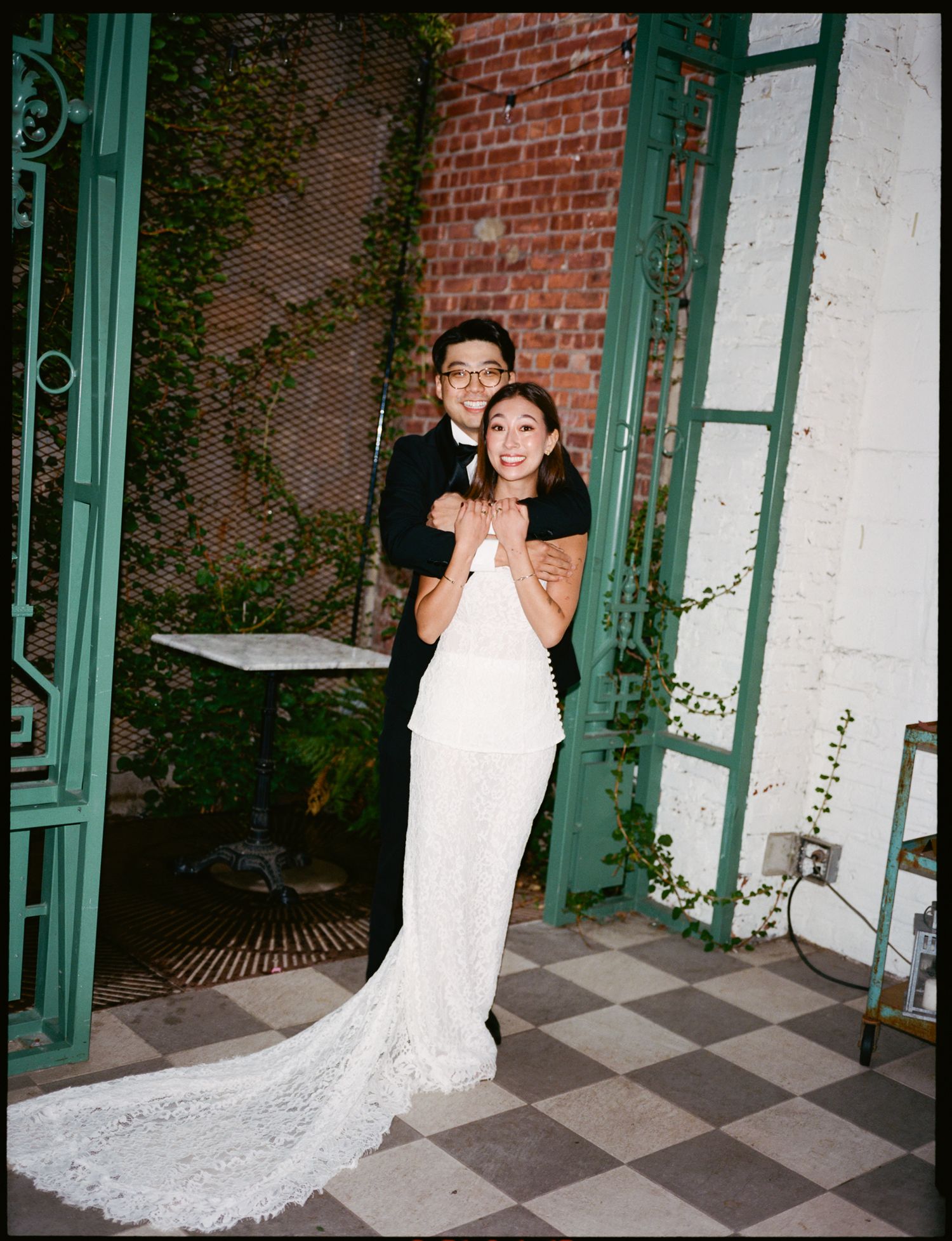A series of four wedding photos showing a couple dancing together on a brick patio with green framed windows.