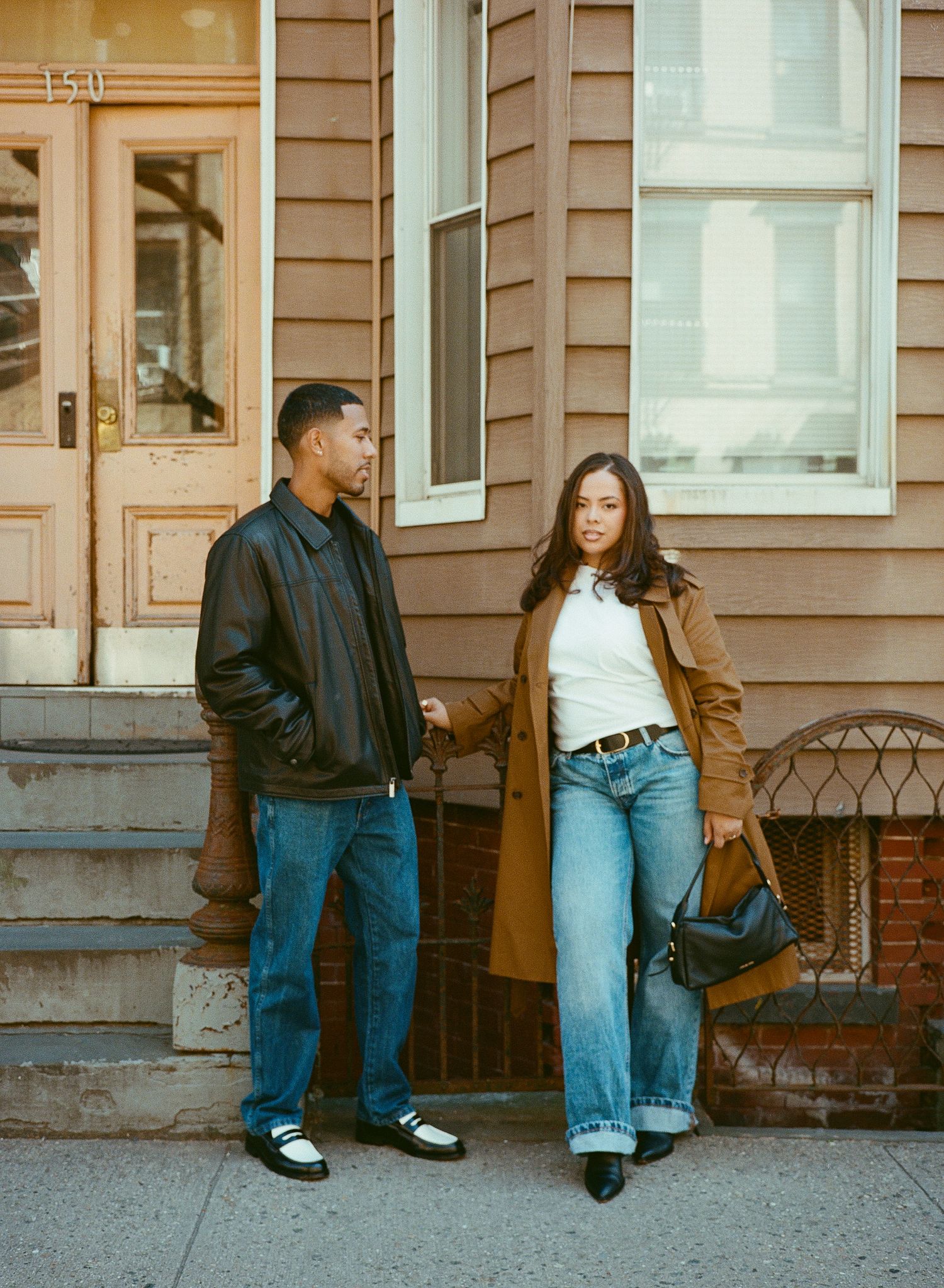 Three connected photos show people sitting on steps of a brown building wearing casual denim and jackets.