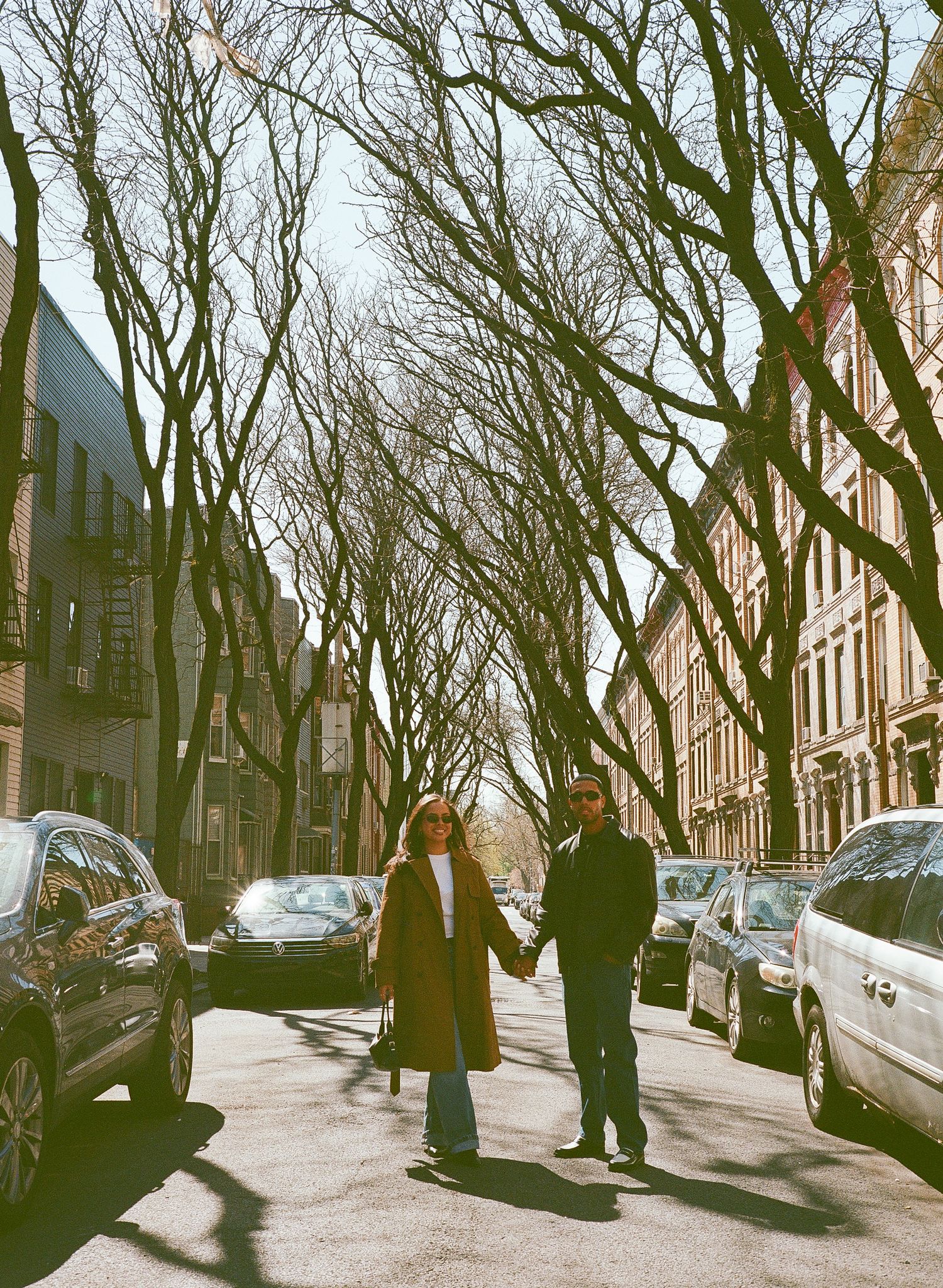 A series of winter street scenes with bare trees lining a snowy residential sidewalk.