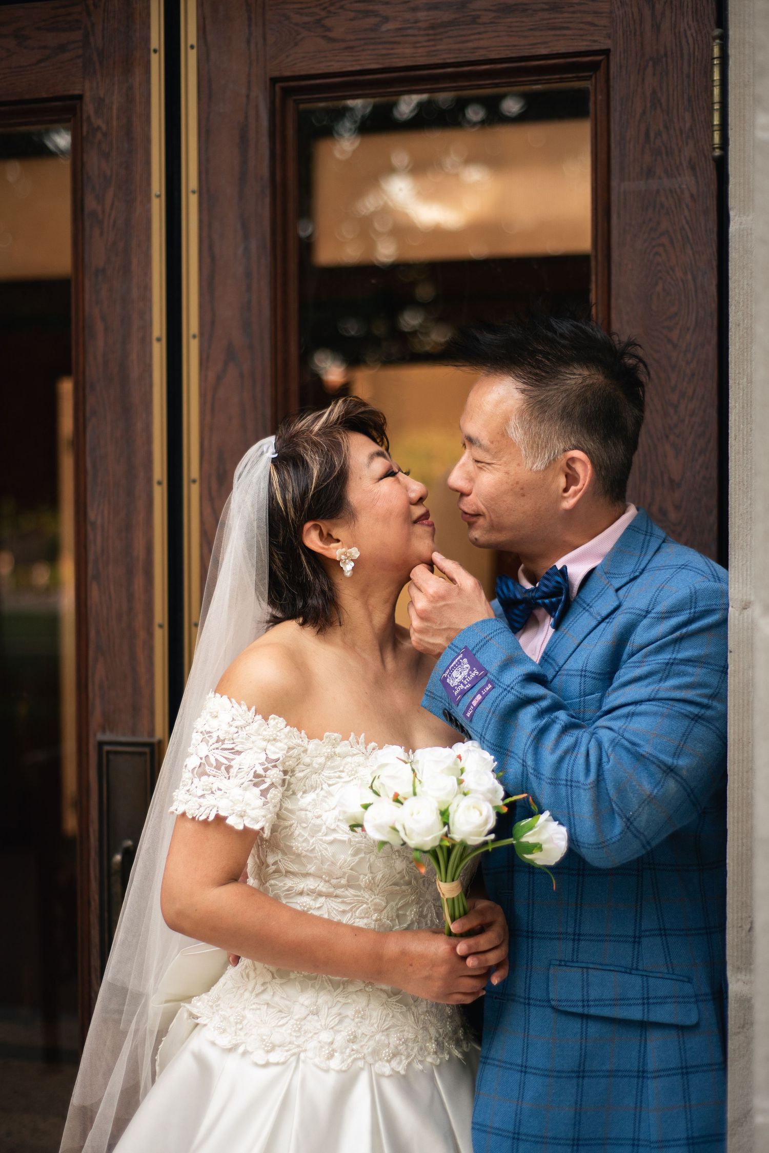 Cinematic wedding portrait taken at the main quad on the University of Illinois Champaign-Urbana campus during golden hour