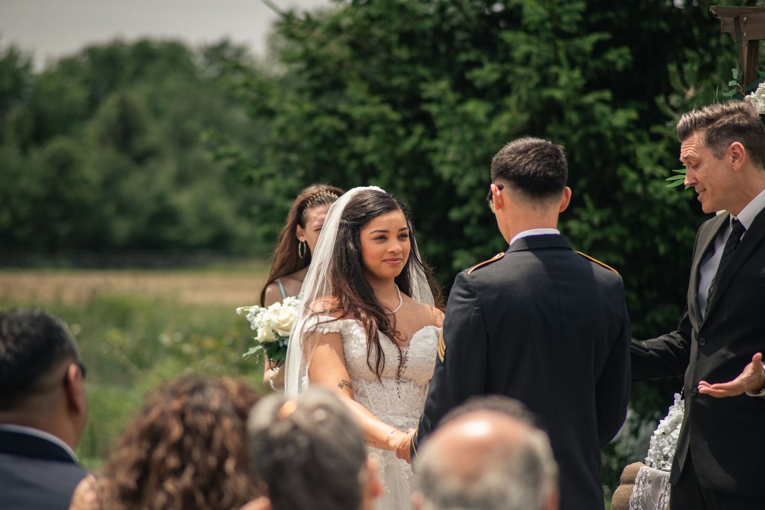 Cinematic style military wedding ceremony photo at Willow Creek Farm in Urbana, IL by wedding photographer Urbana Ever After Photography