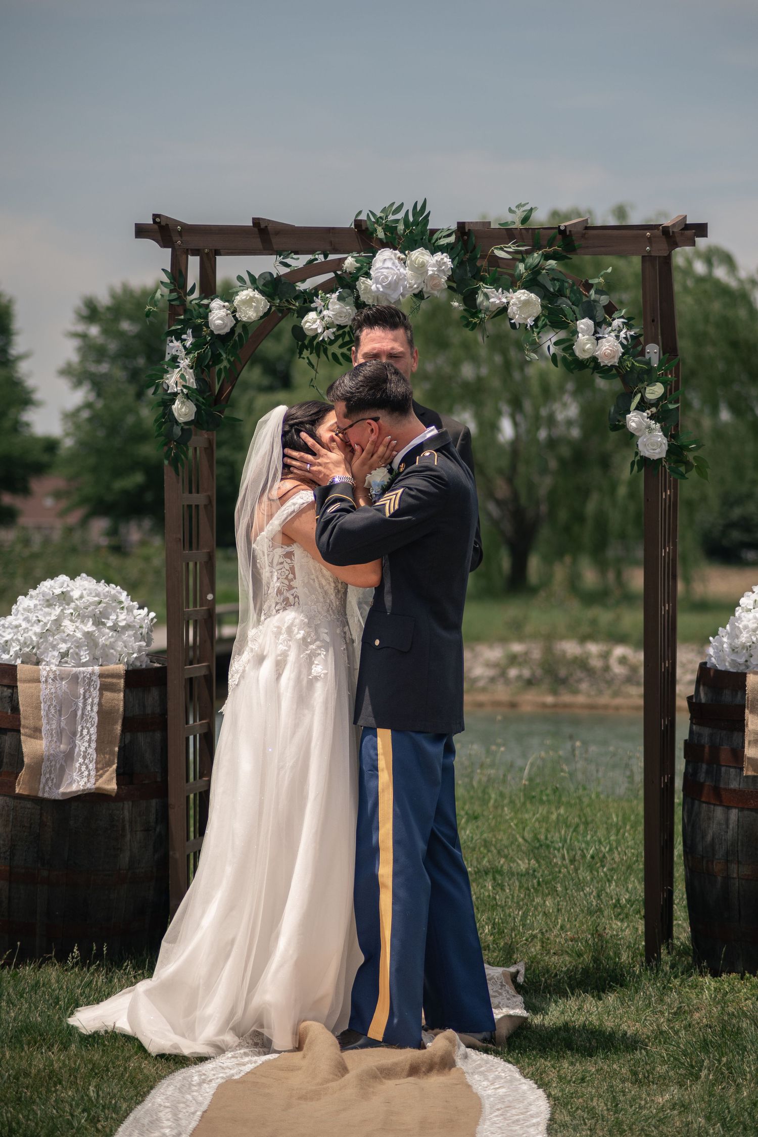 Cinematic style first kiss photo from a summer military wedding at Willow Creek Farm in Urbana, IL by Urbana Ever After Photography