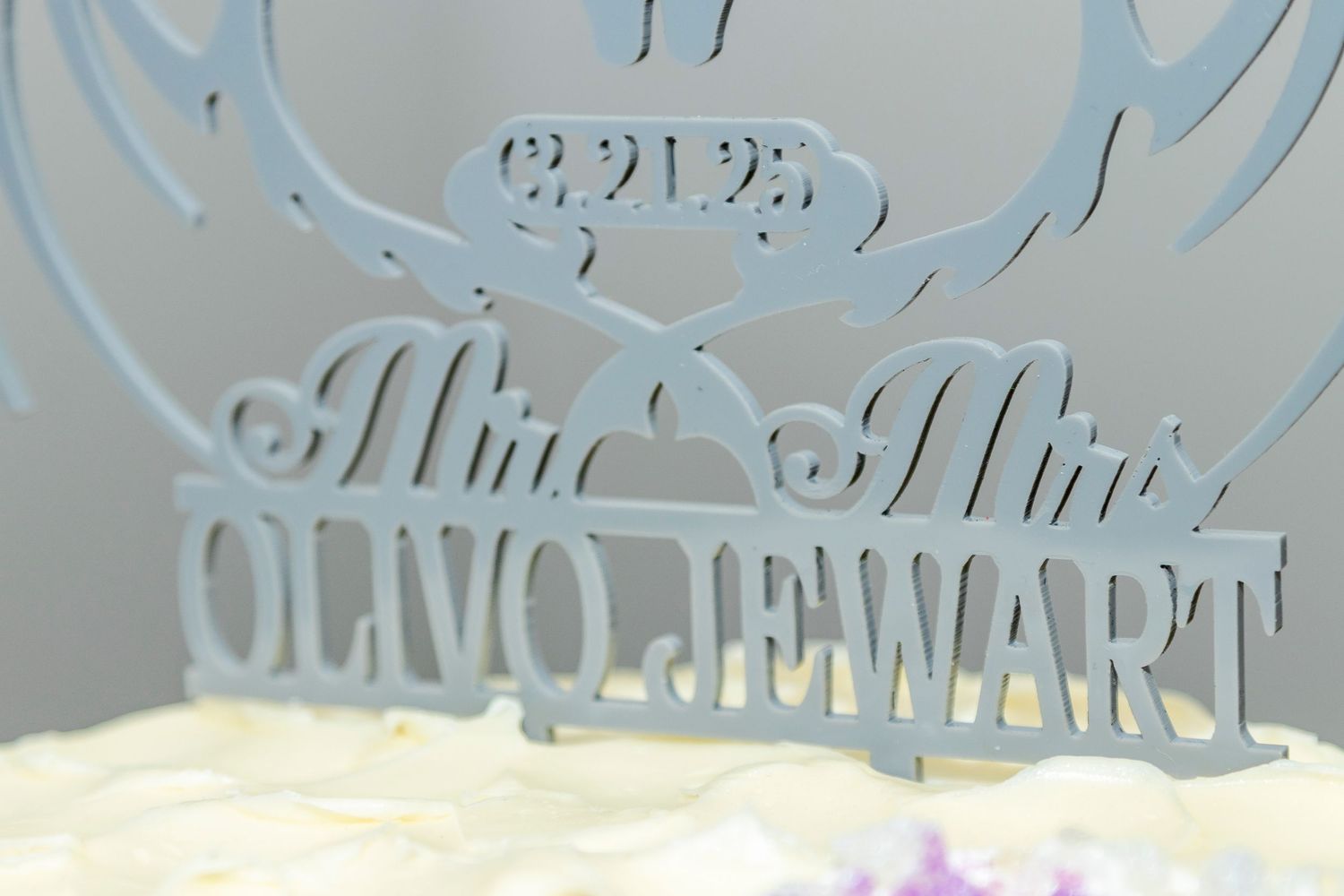 Ornate vintage-style text and decorative elements in a light blue hue against a white background.