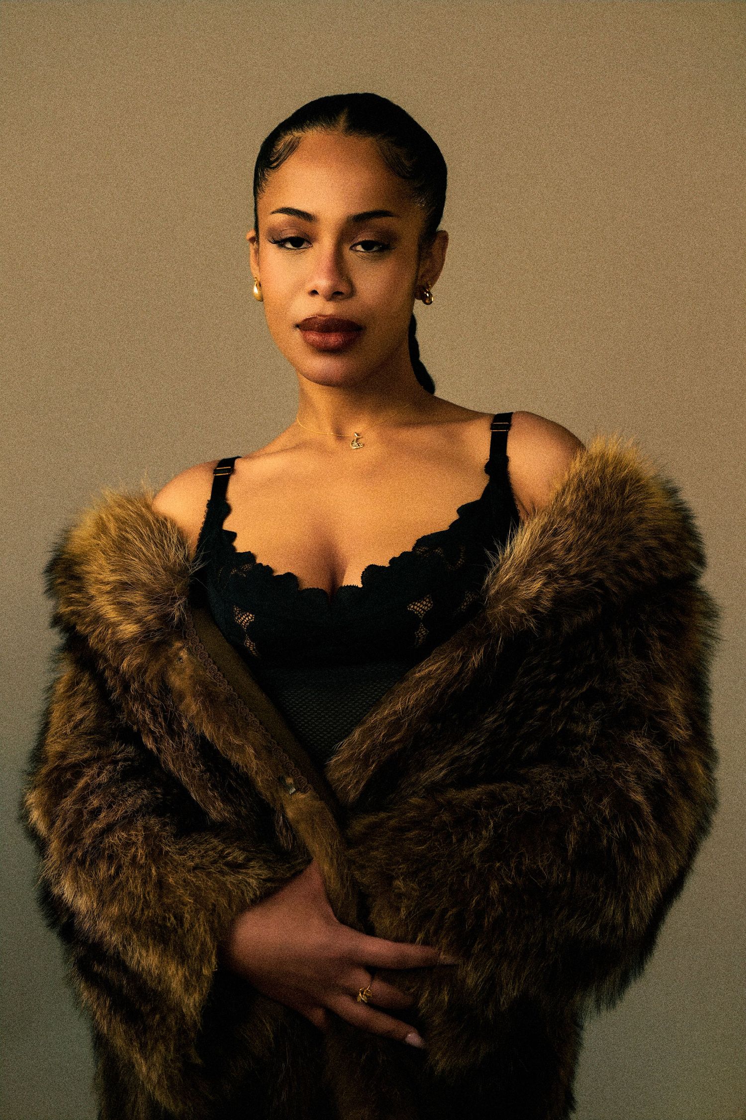 Glamour portraits featuring a brown fur wrap against a neutral studio background.