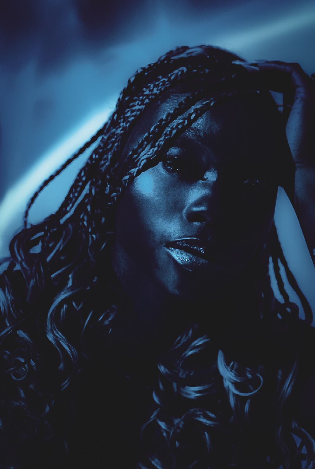 Artistic blue-toned portrait series showing silhouetted profile views.