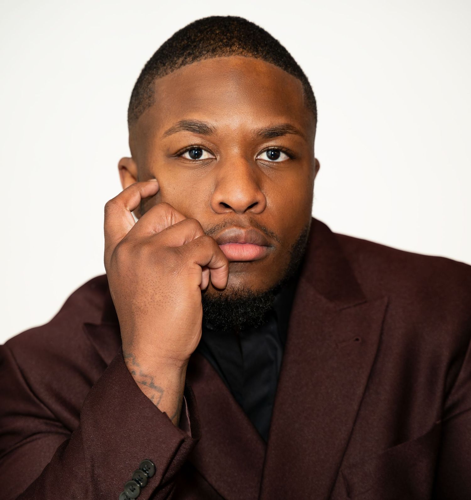 Close-up portrait series showing person in brown suit jacket against white background.