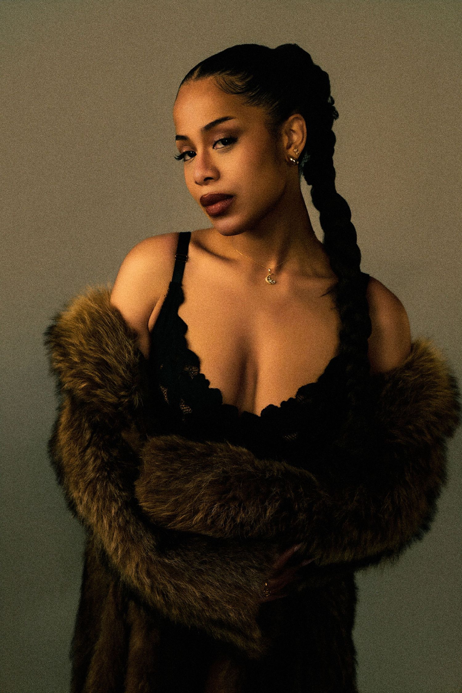 Artistic boudoir photos featuring a brown fur stole against a sepia background.