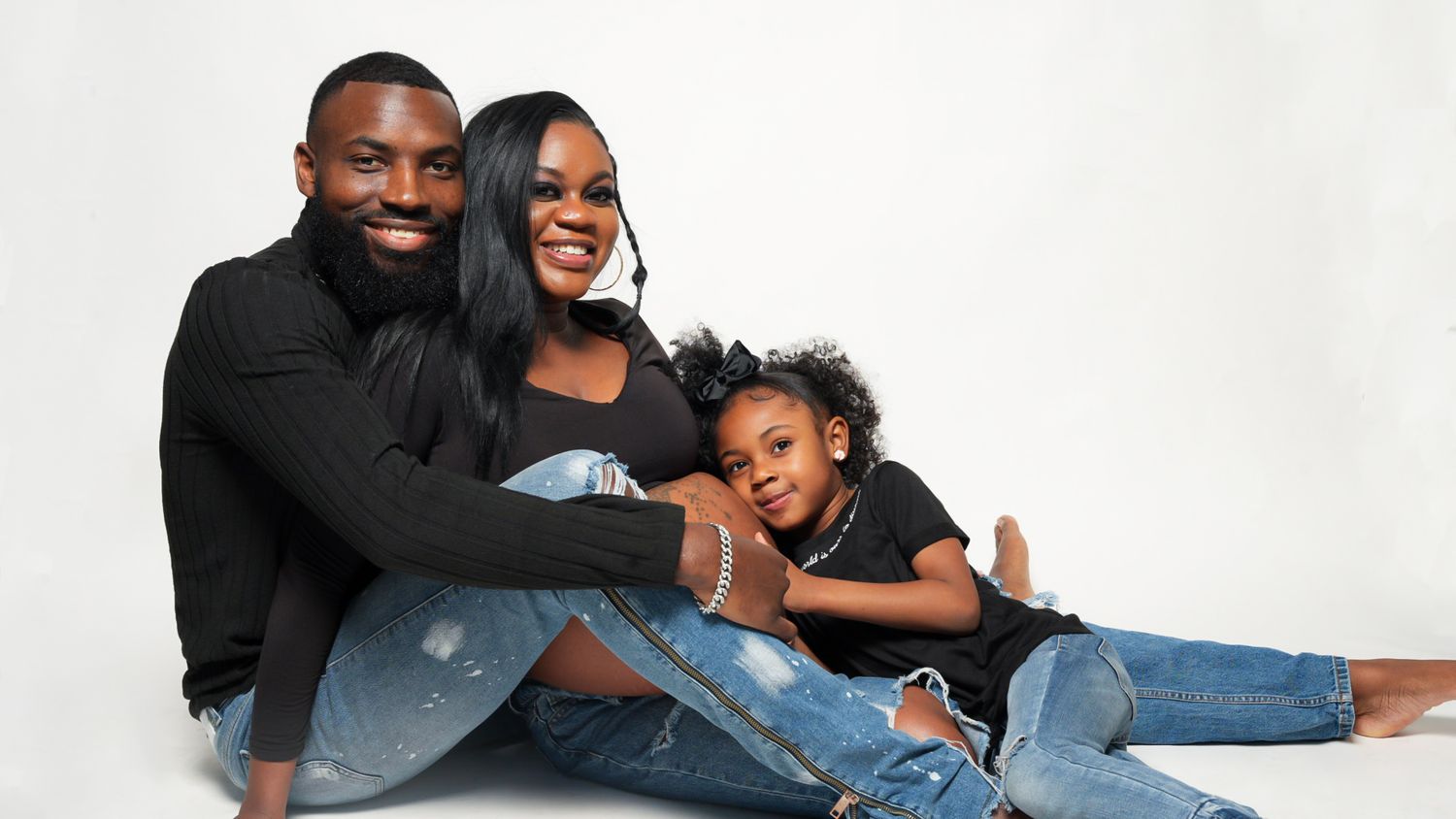 Intimate couple photoshoot with casual poses against white background.