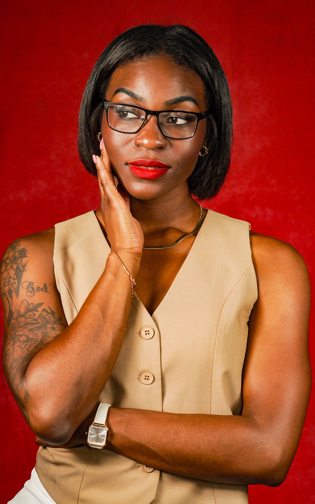 Portrait series against red background showing poses in beige sleeveless top.