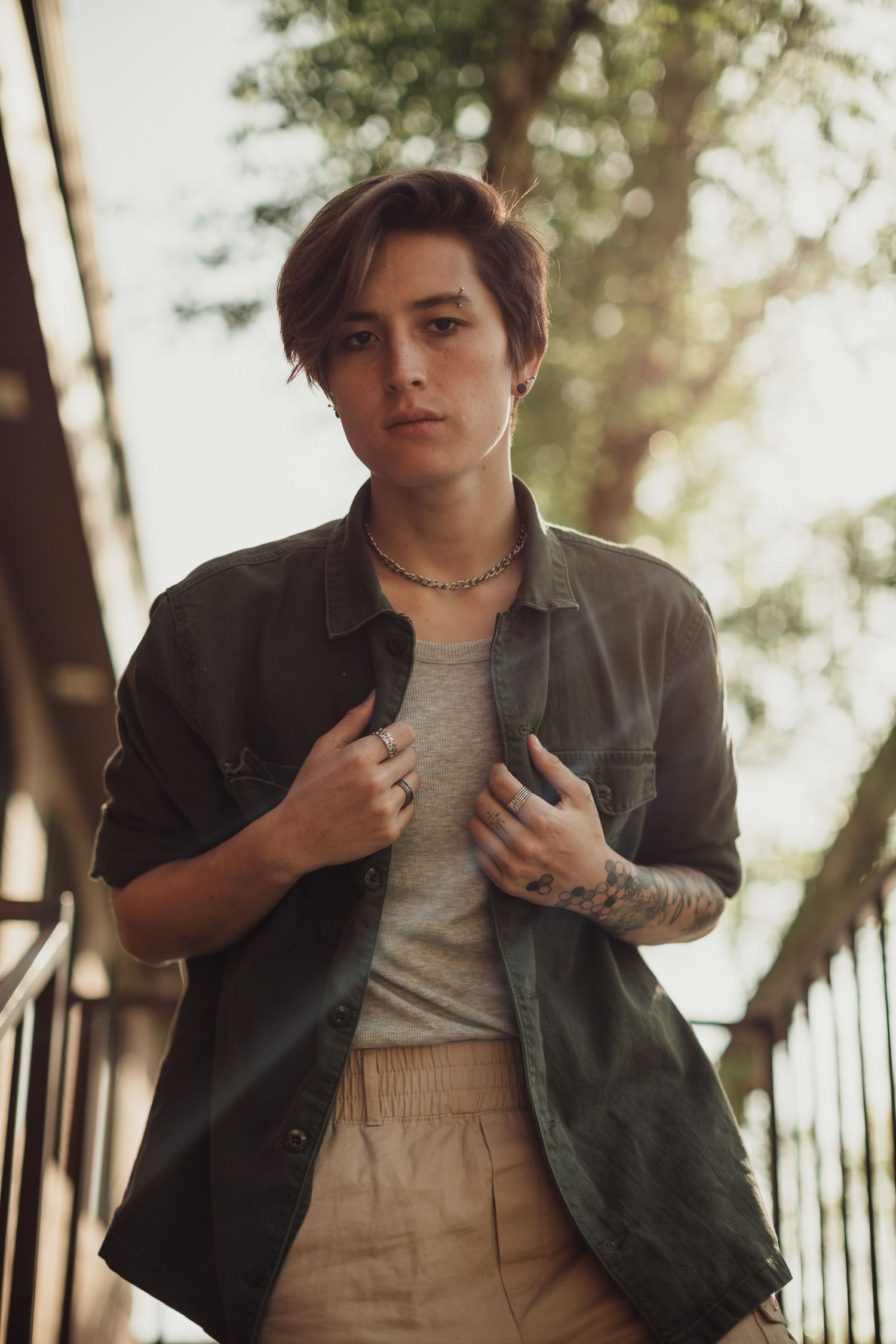Candid outdoor portraits in casual streetwear against natural background.