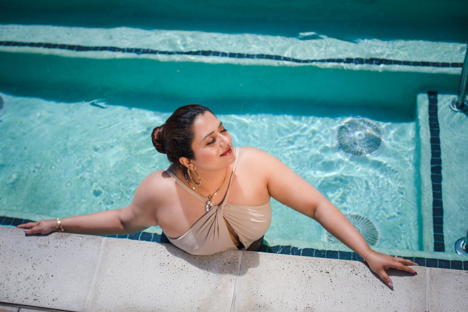 Artistic swimming pool photography series showing movement in turquoise water.
