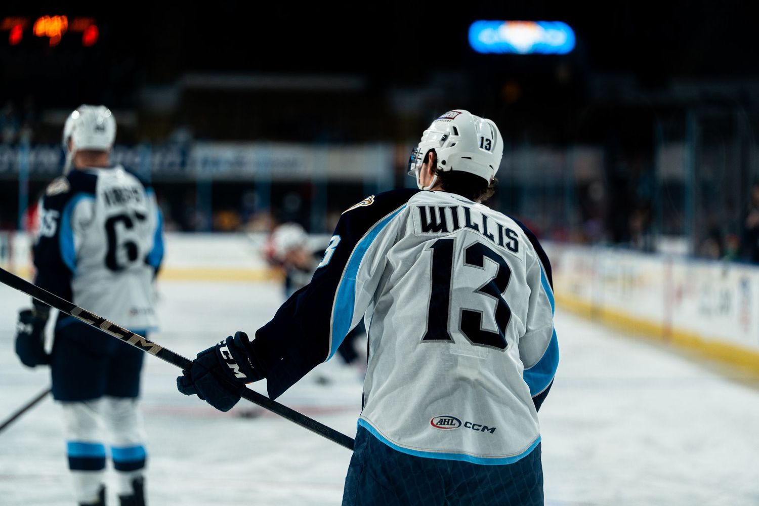 Professional hockey players battle for position during a fast-paced game.