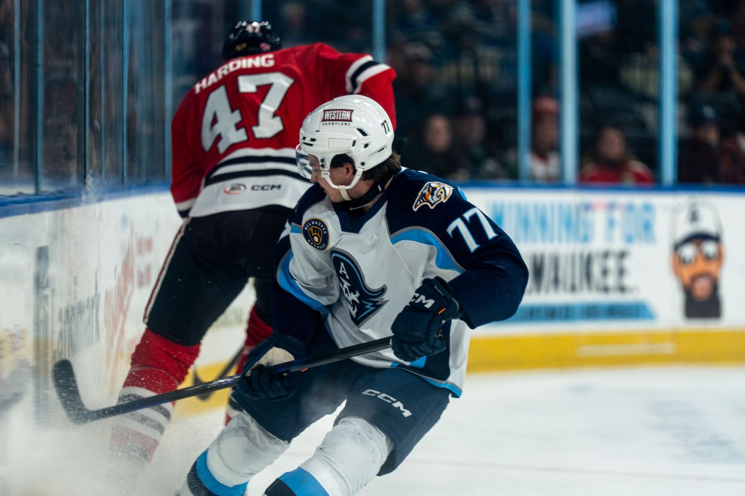 Players battle for position during a professional hockey match on the rink.