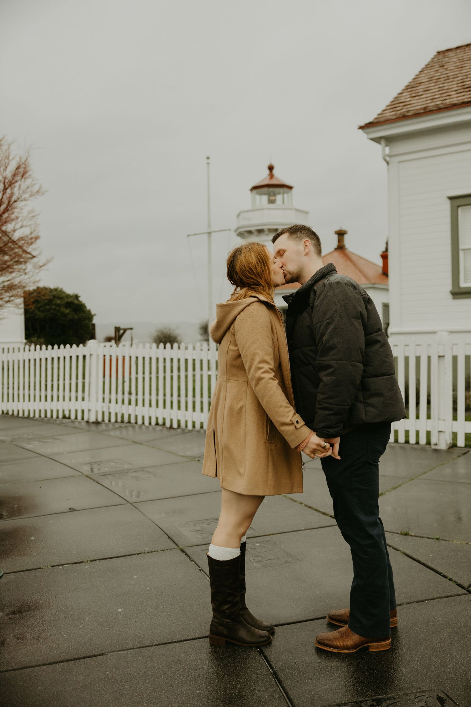 Romantic, cinematic Washington couples photographer rainy day session at Mukilteo lighthouse in Snohomish County