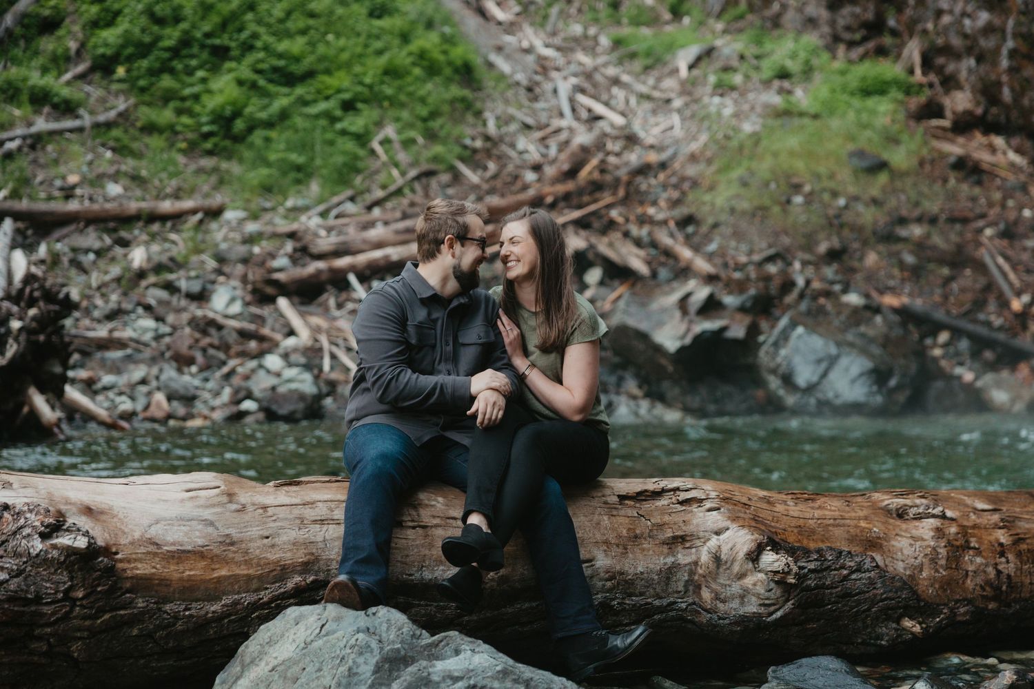 Seattle Washington couple at a secluded waterfall up Snoqualmie Pass during their engagement session