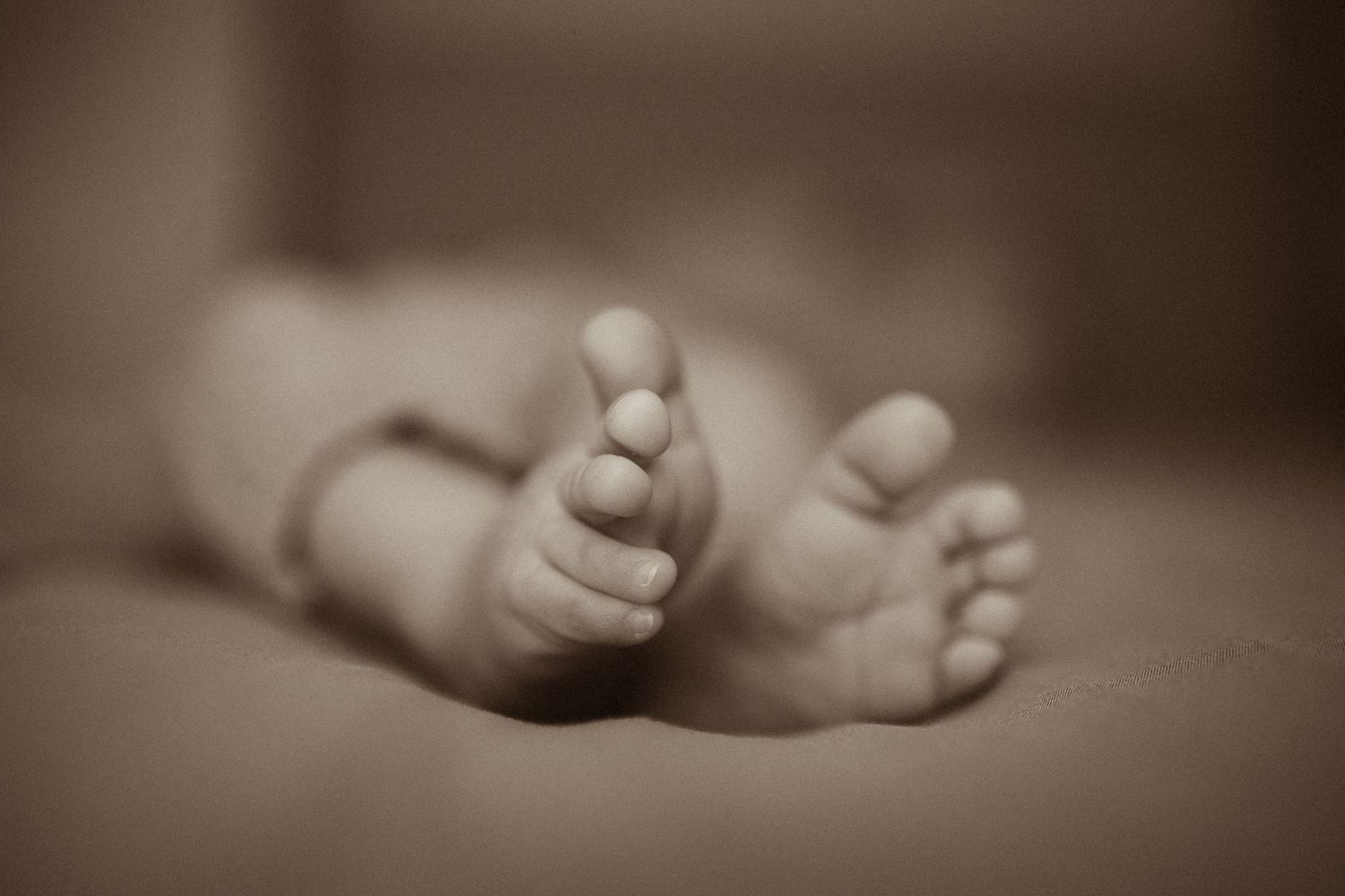 Black and white detail shot of newborn baby's feet by Bowmanville, ON family photographer