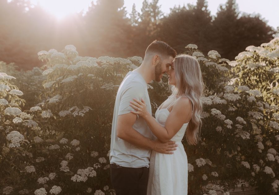Engagement photoshoot with a couple at a flower farm soaking up the moment together.