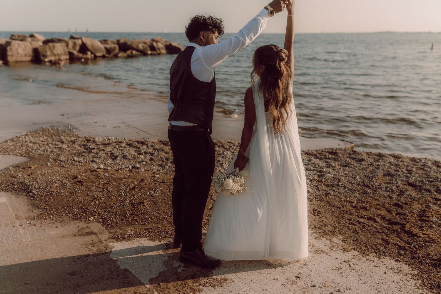 Couple dancing on Toronto waterfront by natural wedding photographer Bowmanville