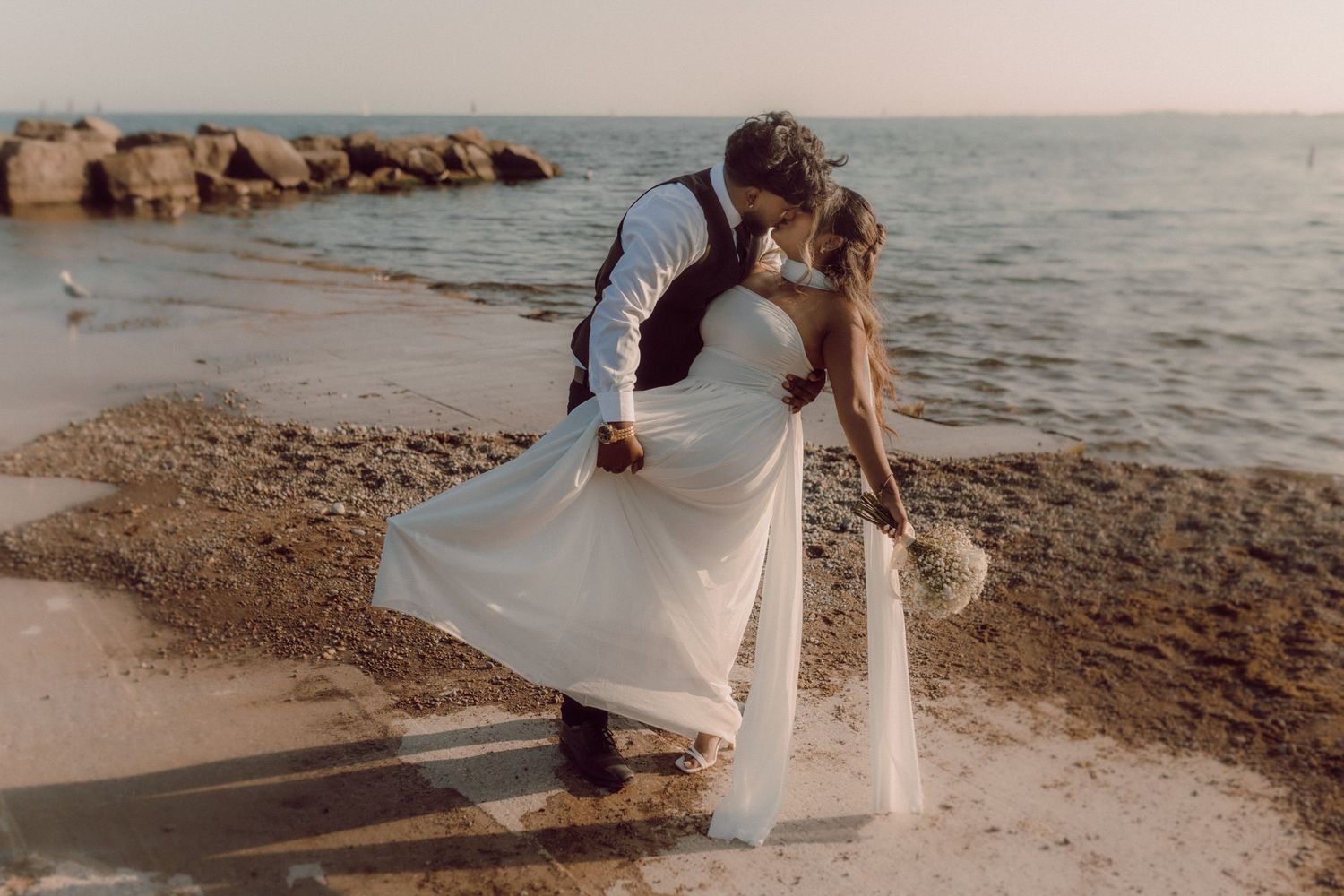 Groom dipping his bride after eloping by Durham Region elopement photographer