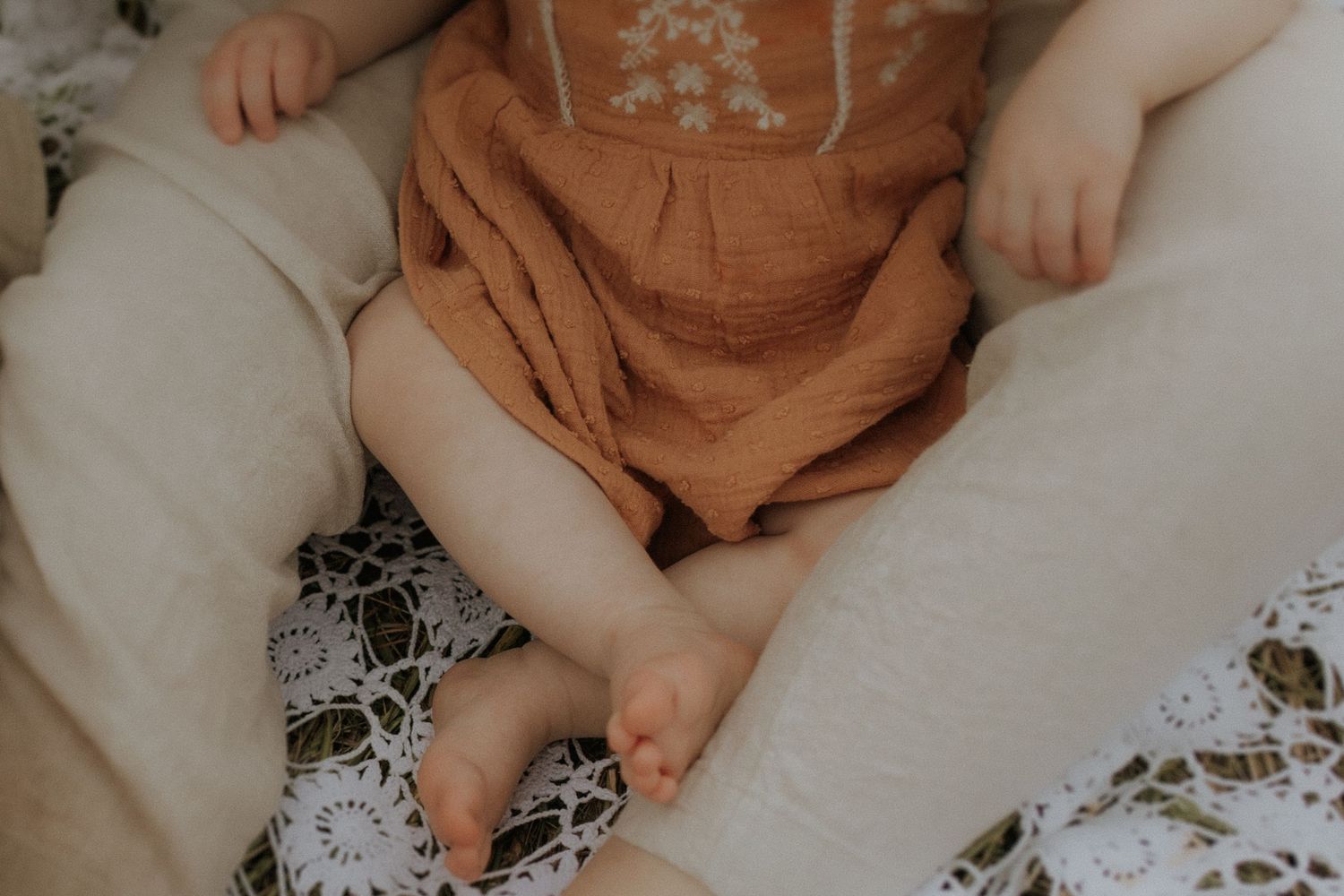 Close-up of a mother and daughter sitting together during a motherhood session