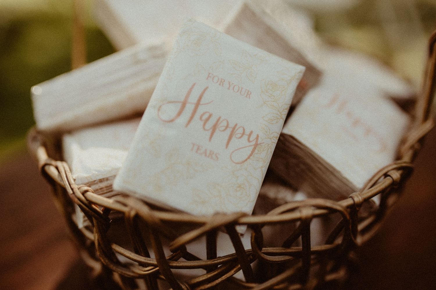 Close-up image of 'Happy Tears' tissues at a backyard wedding for emotional wedding photography Durham Region