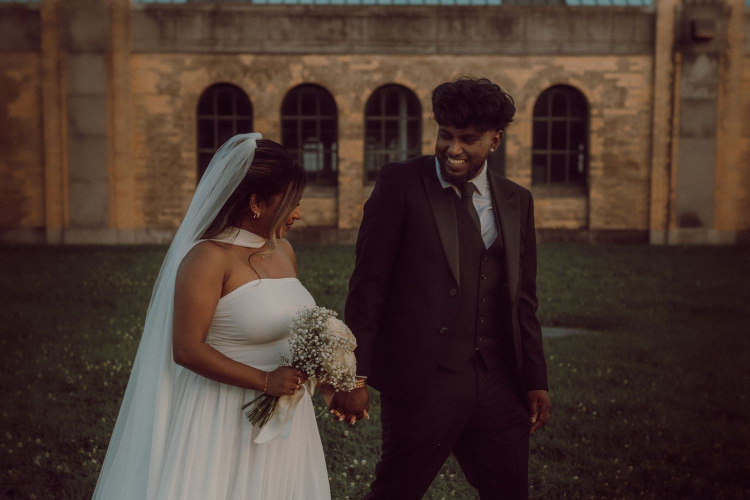 Close-up of bride and groom walking together after eloping by candid wedding photographer Durham Region