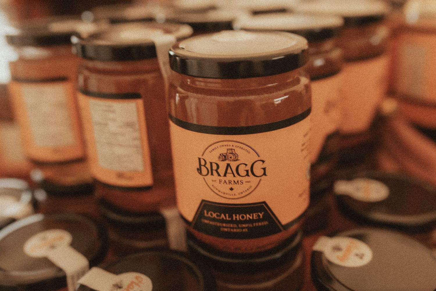 A close-up image of the jars of honey at Bragg Farms by Durham Region family photographer
