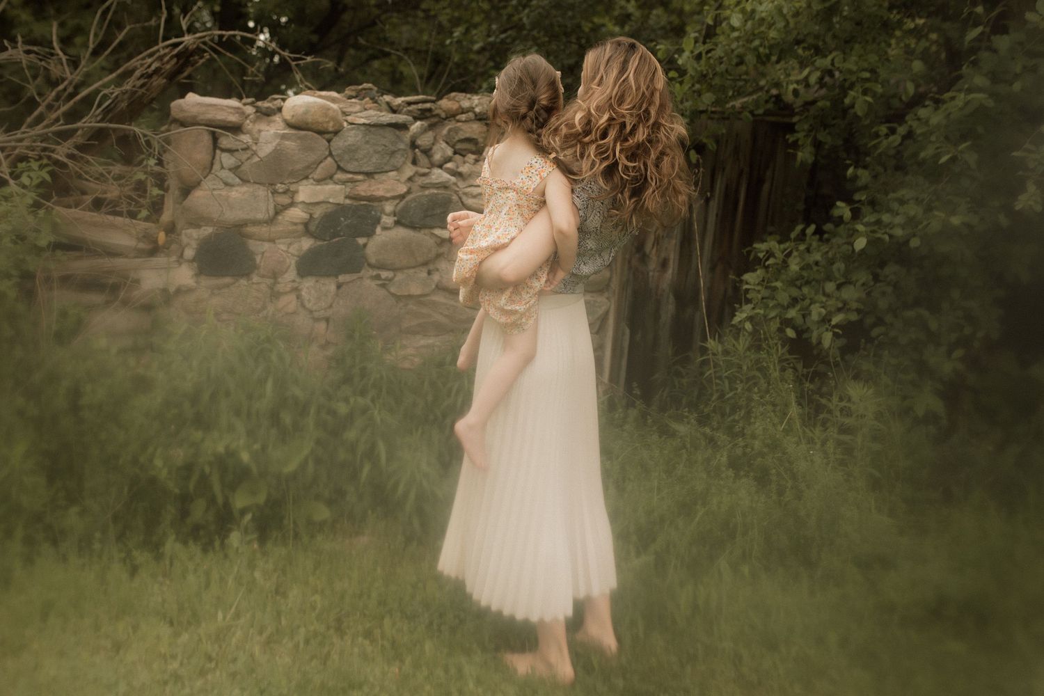 Mother holding her daughter close during a motherhood photography session in Durham Region, Ontario