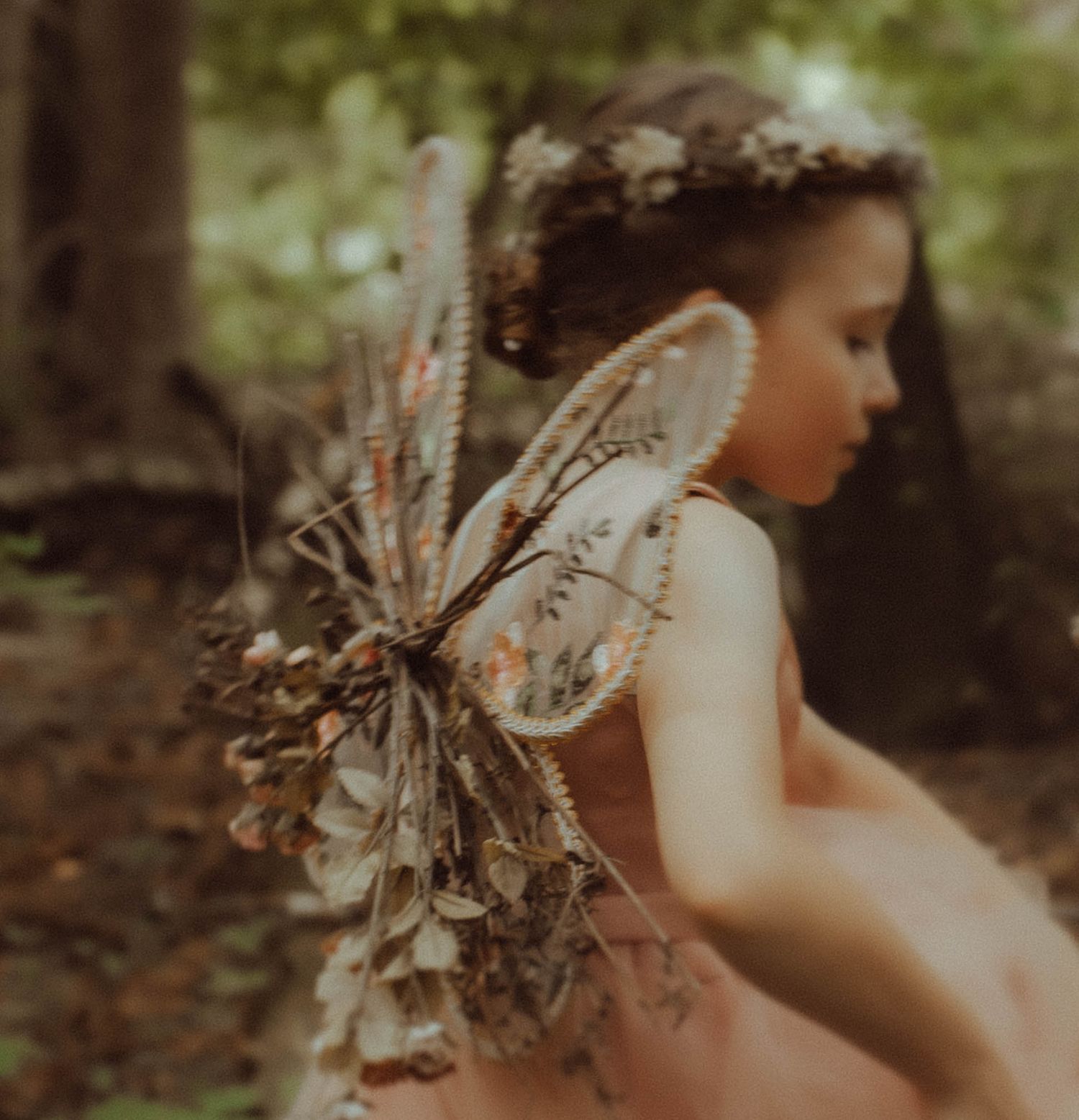 Dreamy golden hour photoshoot in a forest setting with romantic lighting and delicate details.