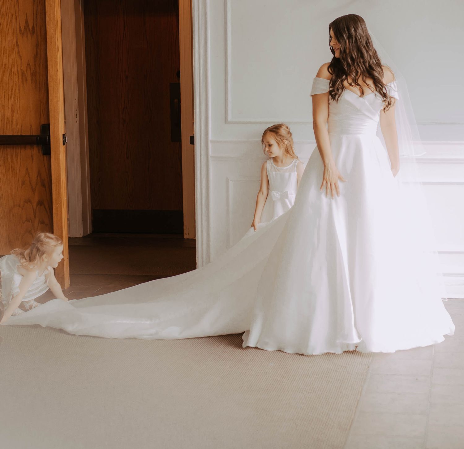 Bride with two girls before her small wedding by candid wedding photographer Durham Region