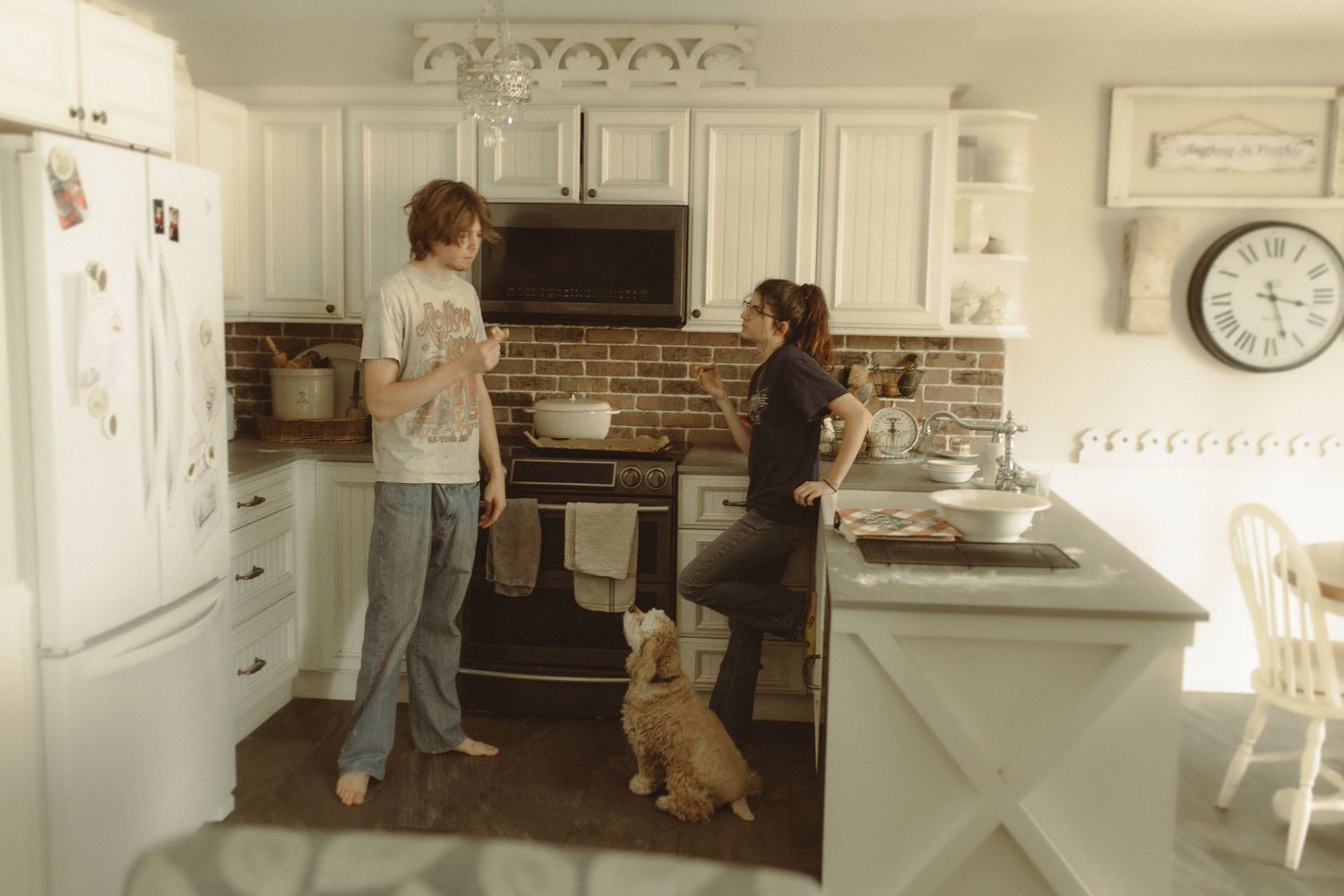 A couple baking together in a cozy kitchen in Bowmanville, ON.  Taken by your family and maternity photographer in Durham and Northumberland