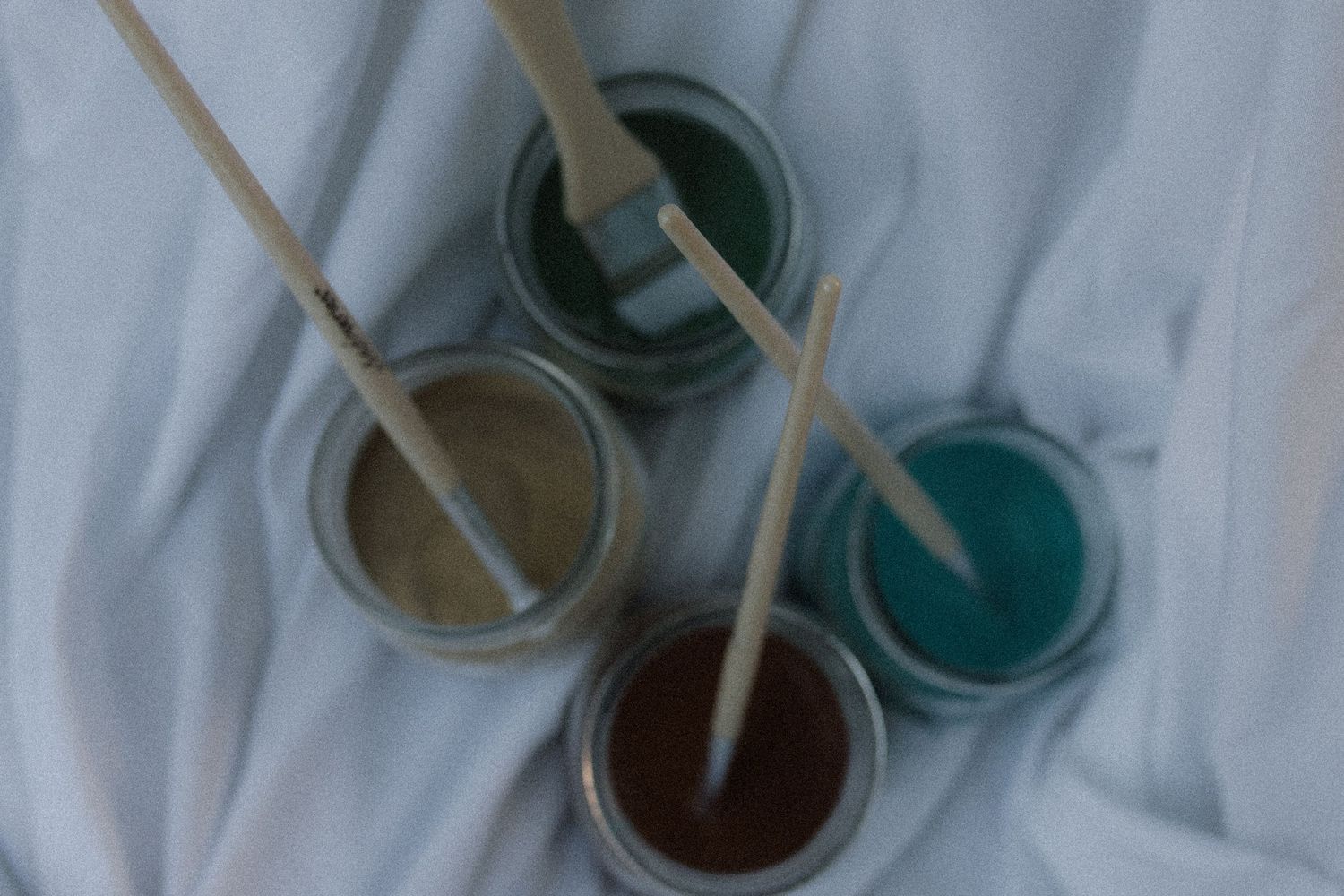 A close-up image of the jars of paint used during a painting session with a mom and son by Courtice family photographer
