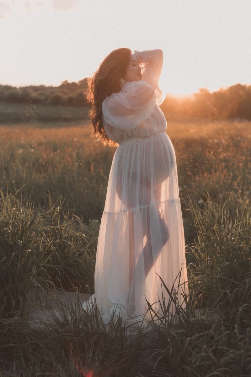 Golden hour light-filled maternity session in outdoor field taken by a Bowmanville, ON family photographer
