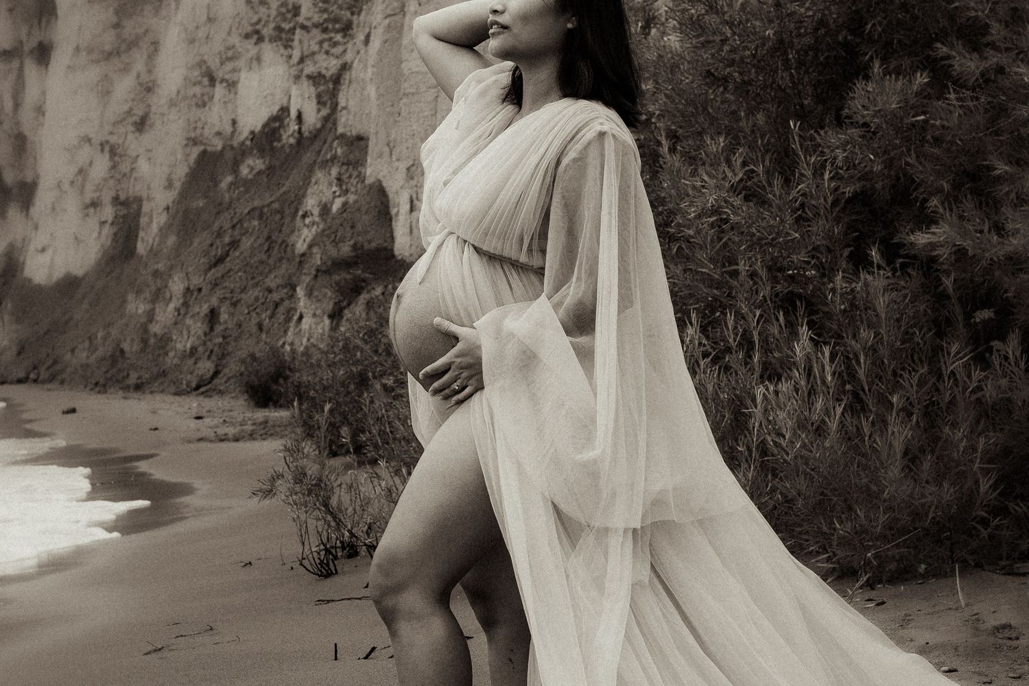 Pregnant mother in a flowing dress during a maternity session by Bowmanville family photographer