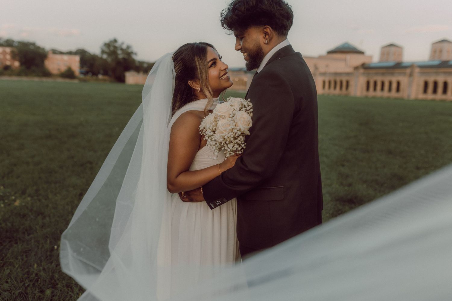 Happy couple smiling at each other after elopement ceremony by natural wedding photographer Bowmanville