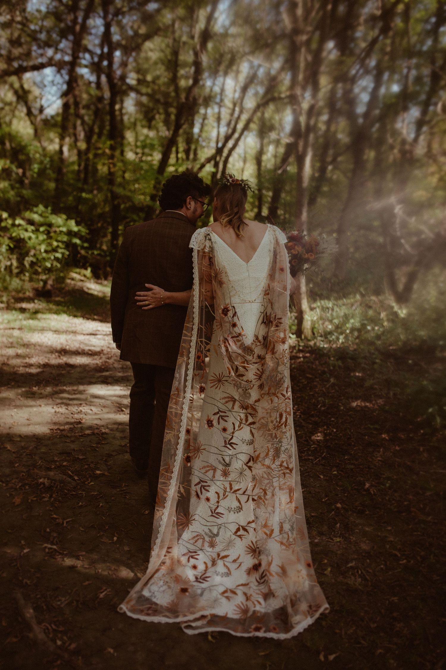 Back view of a beautiful veil embroidered with fall colours by Cobourg Wedding and Elopement Photographer