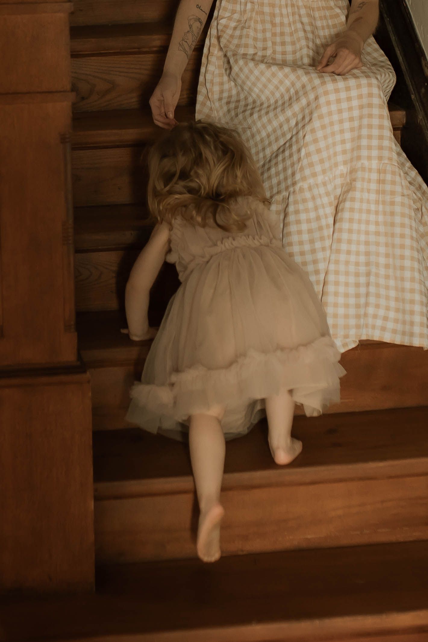 Mother watching her daughter during a candid motherhood photography session in Durham Region, Ontario