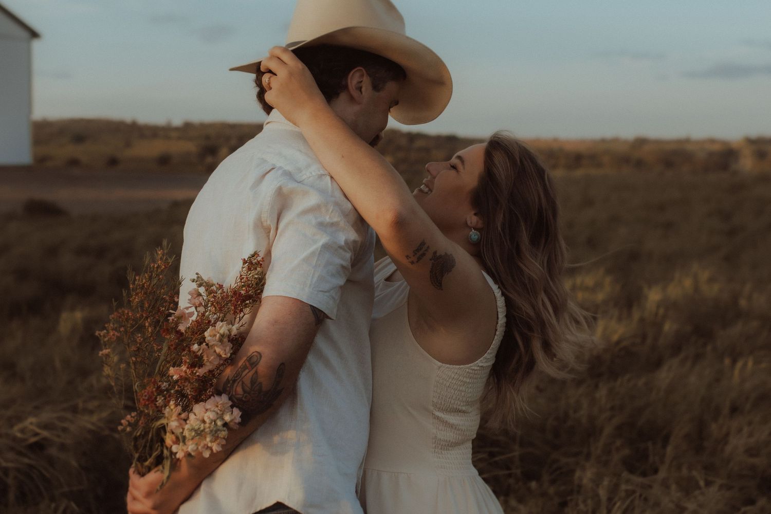 Outdoor engagement session in Orono countryside at sunset by family photoographer