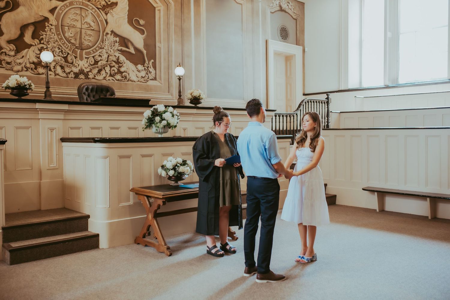 A couple exchanging vows during an elopement at Victoria Hall by Cobourg Elopement Photographer
