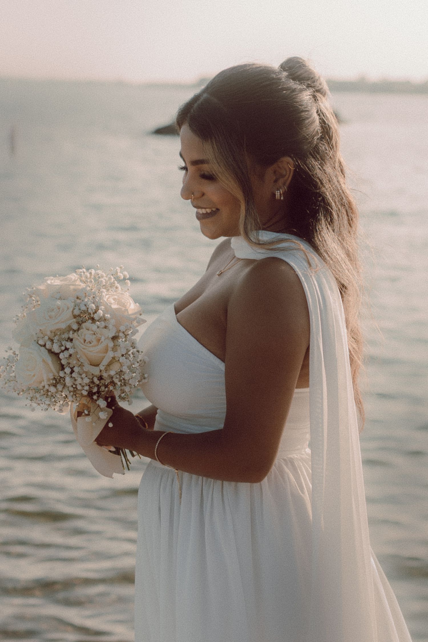 close-up image of a bride on a beach by  Durham Region wedding photographer