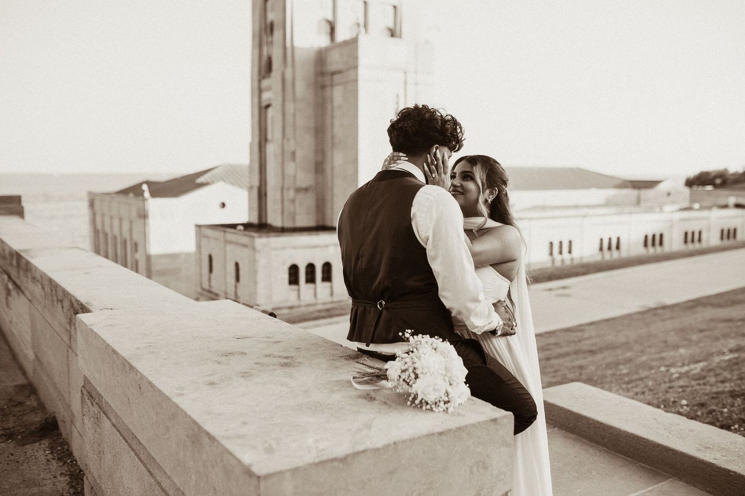 Couple leaning against a stone wall at R.H. Harris in Toronto by  Durham Region elopement photographer