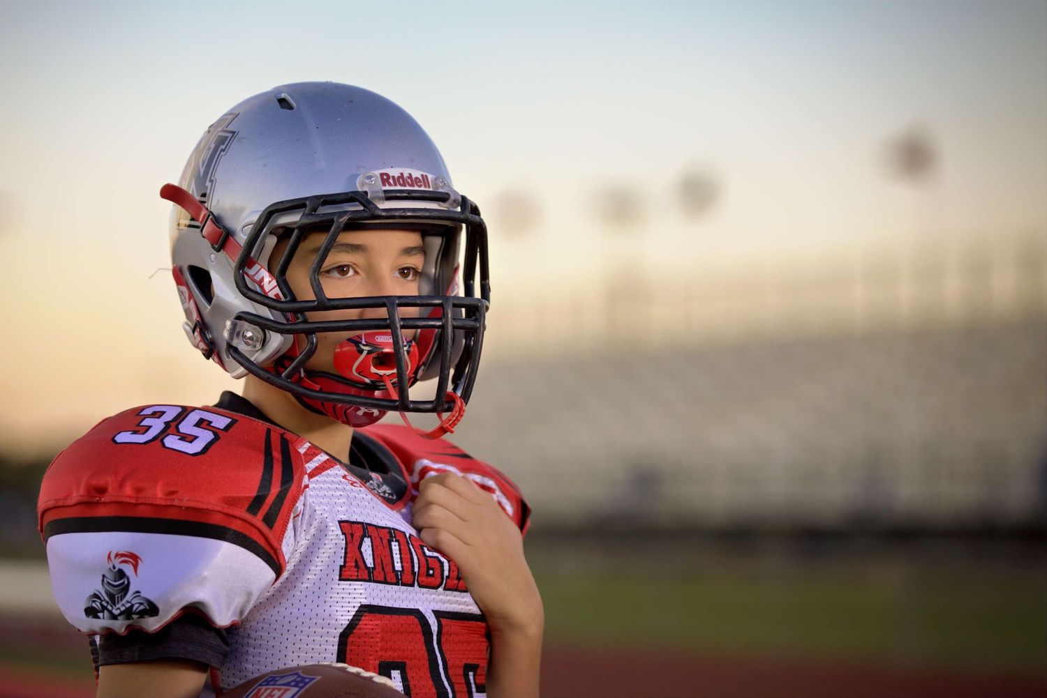 Multiple photos showing an athlete in red sports uniform and protective gear on a playing field.