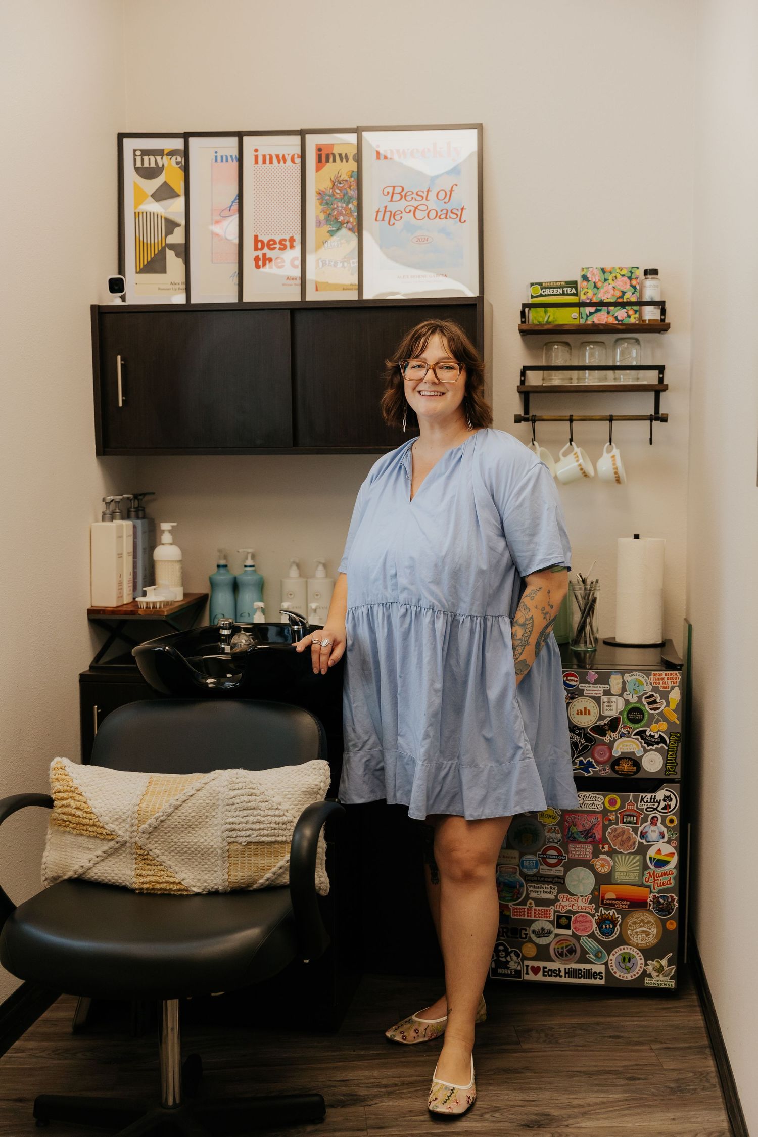 A series of salon chair photos showing different angles of a light blue top and professional hair styling workspace setup.