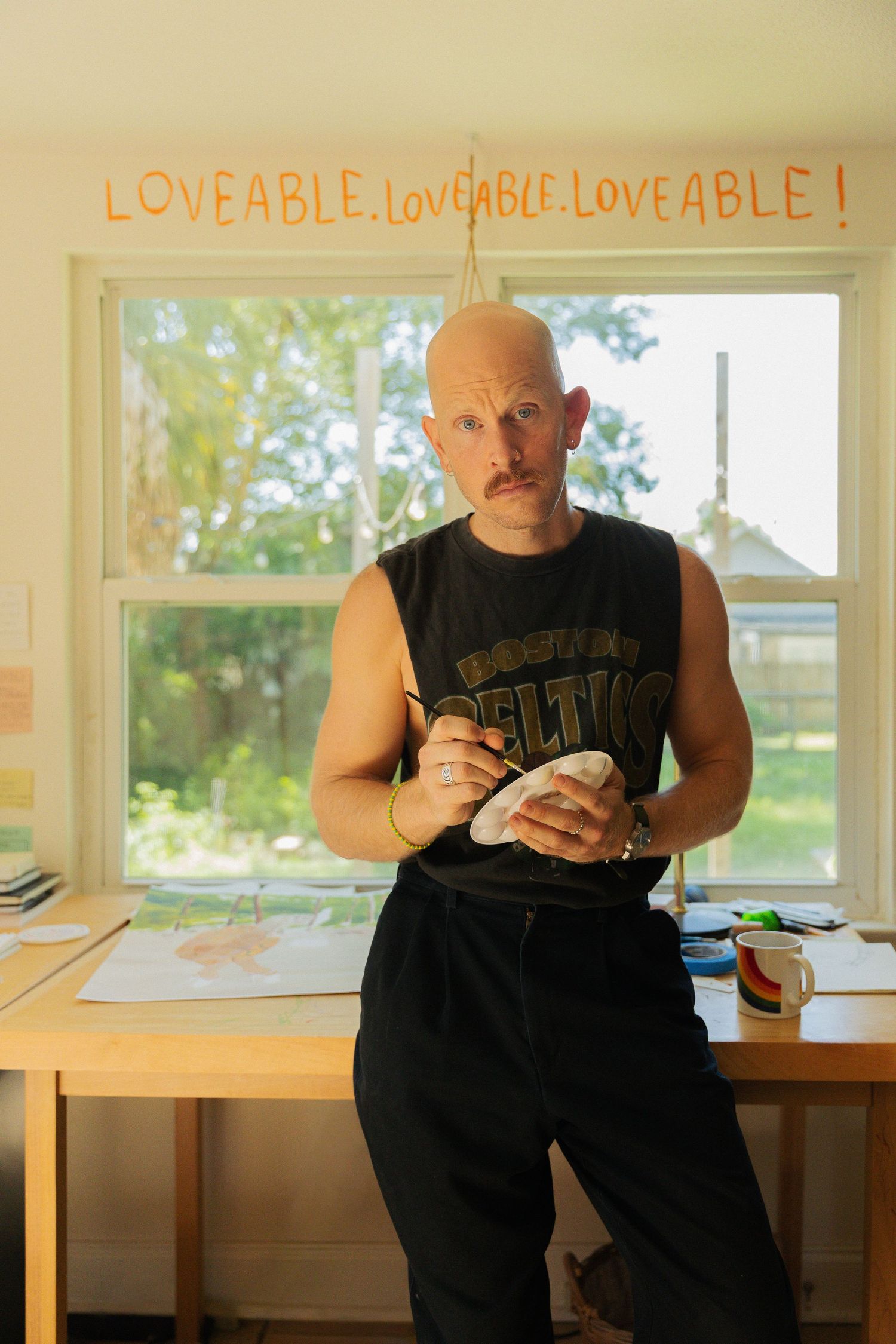 A sequence of four photos shows someone in a black tank top sitting by a window while looking at their phone.