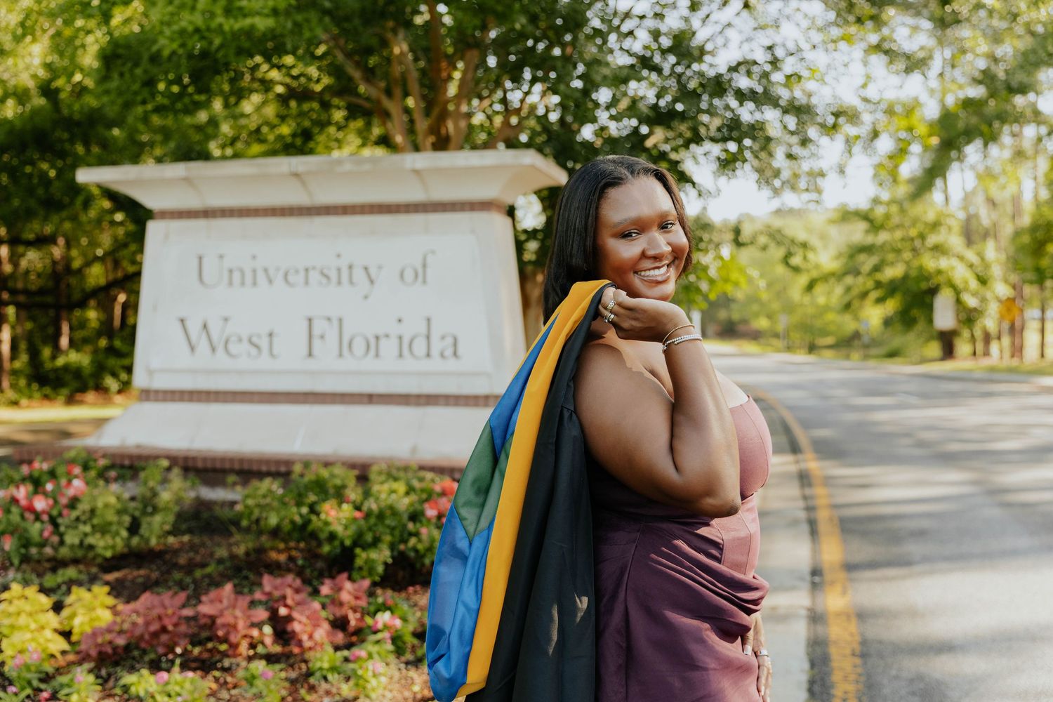 A series of outdoor graduation photos taken at the University of West Florida campus on a sunny day.
