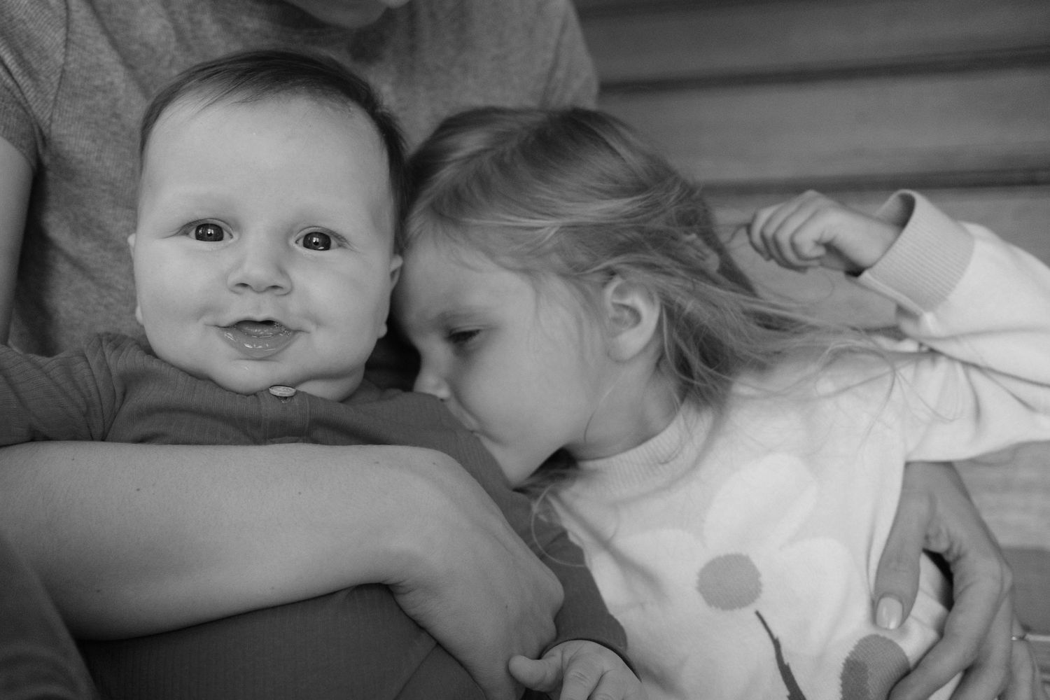 Black and white series showing children's playful interactions on stairs.