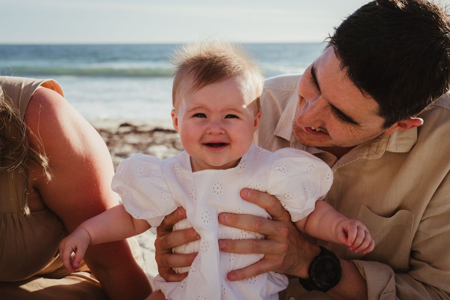 Baby smiling with dad