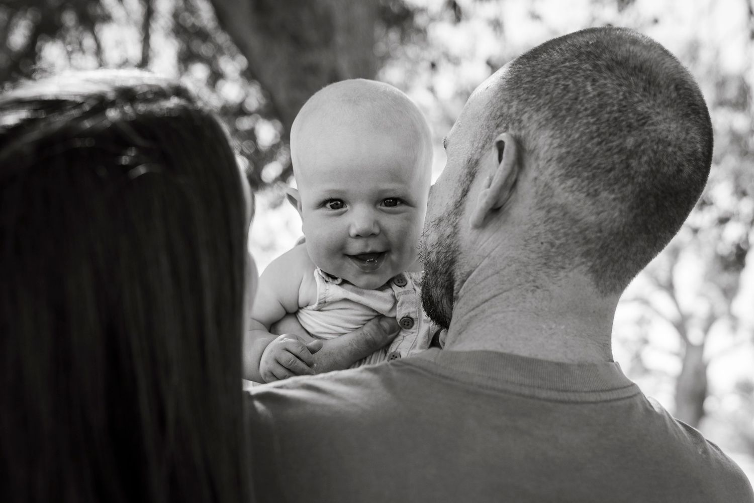 Baby smiling at camera